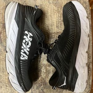 Black HOKA tennis shoes